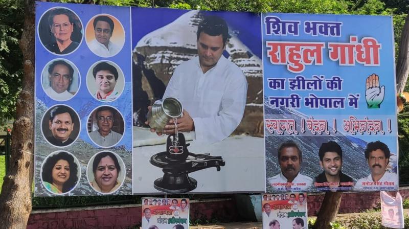 Life-size cutouts and huge posters describing Gandhi as a devotee of Lord Shiva have come up in the city. In the posters, Rahul Gandhi is seen pouring holy water on Shivalinga. (Photo: Twitter | ANI)