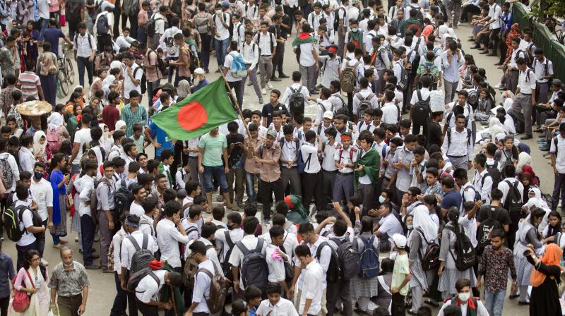 Bangladeshi students shout slogans and block a road during a protest in Dhaka, Bangladesh on Saturday. (Photo: AFP)