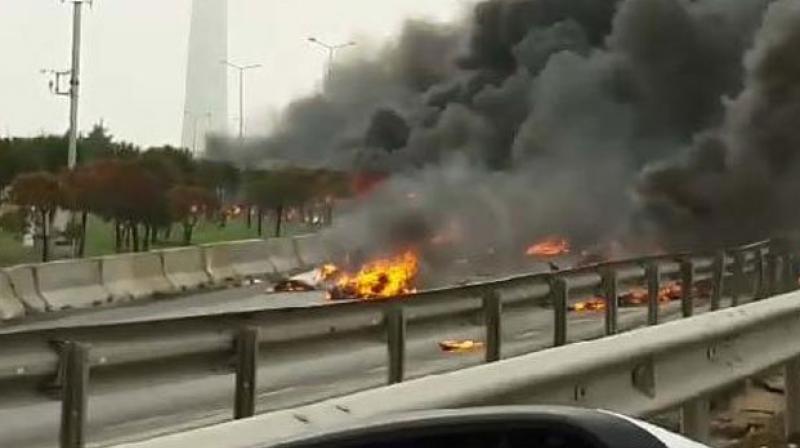 Eyewitness Fikret Karatekin, a taxi driver, told CNN-Turk television by telephone that the helicopter slammed into the tower before crashing on the highway. (Photo: Twitter)