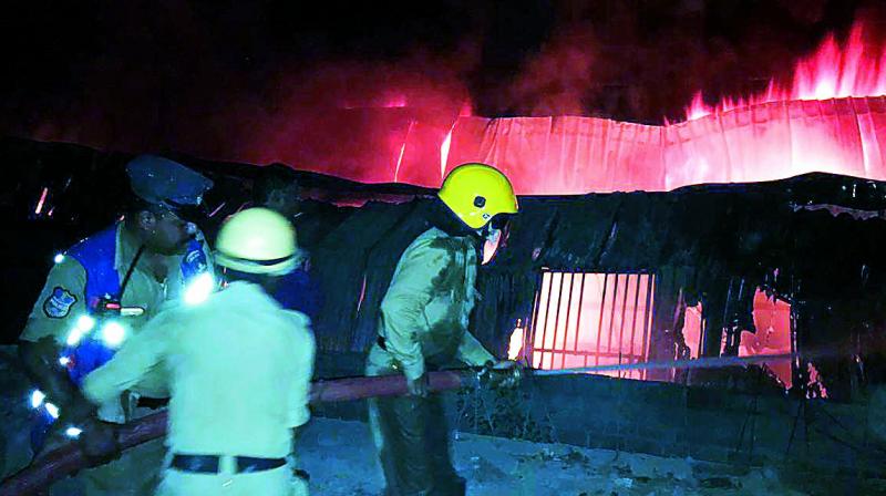 Fire brigade personnel try to douse a fire that broke out at an air cooler manufacturing unit at Attapur, killing six persons on Wednesday. 	 DC