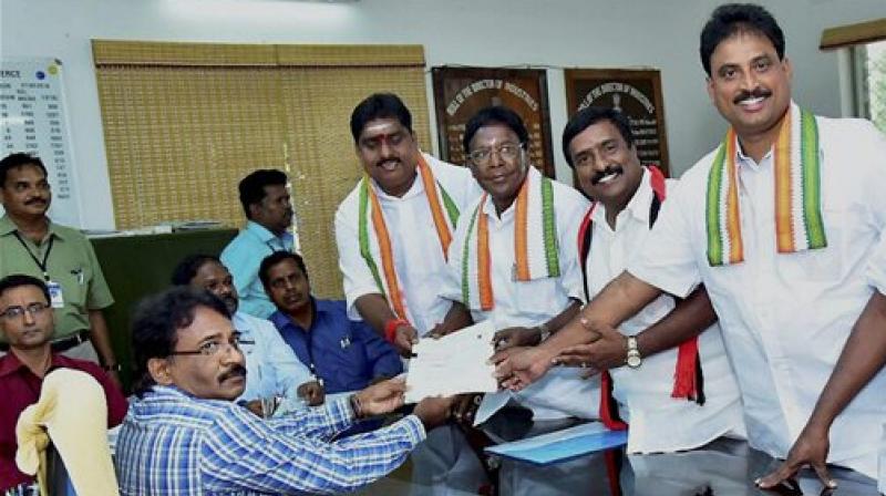 Chief Minister V Narayanasamy (second from left) filed the nomination for the by election from Nellithope constituency in Puducherry on Wednesday. (Photo: PTI)