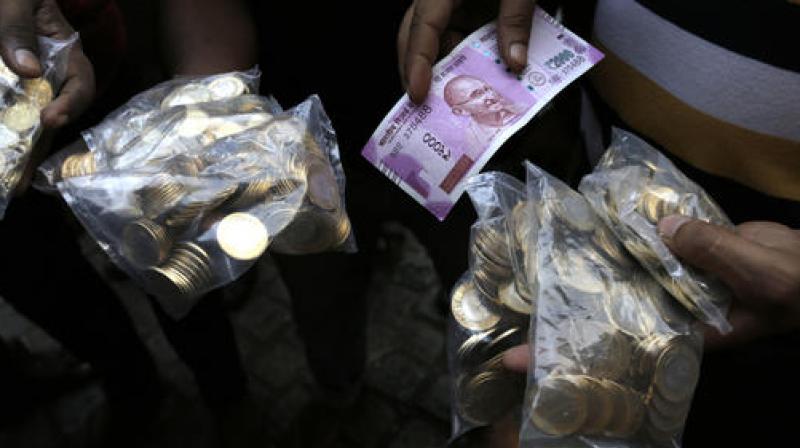 Many banks have been giving people bags of coins in exchange of old notes. (Photo: PTI)