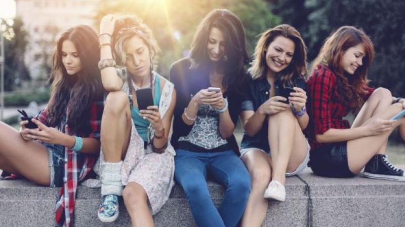 Thirty-five per cent of teens said texting is their favourite way to communicate with friends (Photo: AFP)