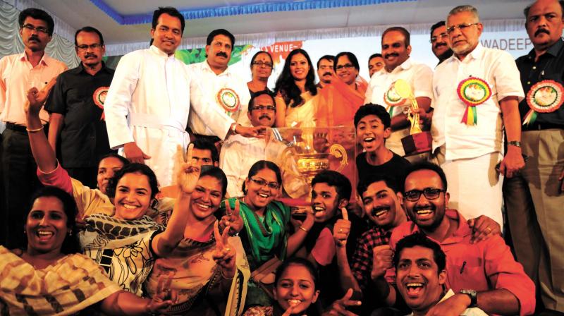 Team members of Thrissur Sahodaya celebrate after receiving the overall trophy in CBSE state school youth festival in Adimali on Sunday. 	(Photo: ARUNCHANDRA BOSE)