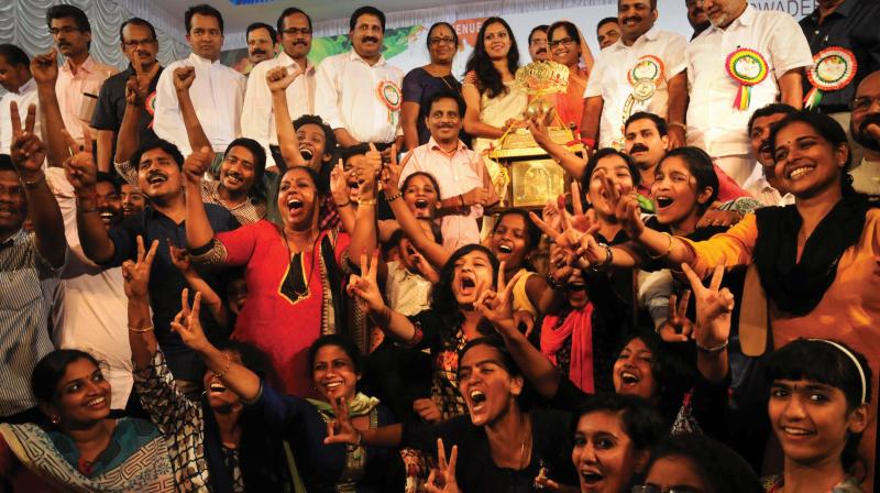 Students and teachers of Silver Hills Public School, which was named the aggregate winner as well school champions, celebrate after receiving their trophy on Sunday.