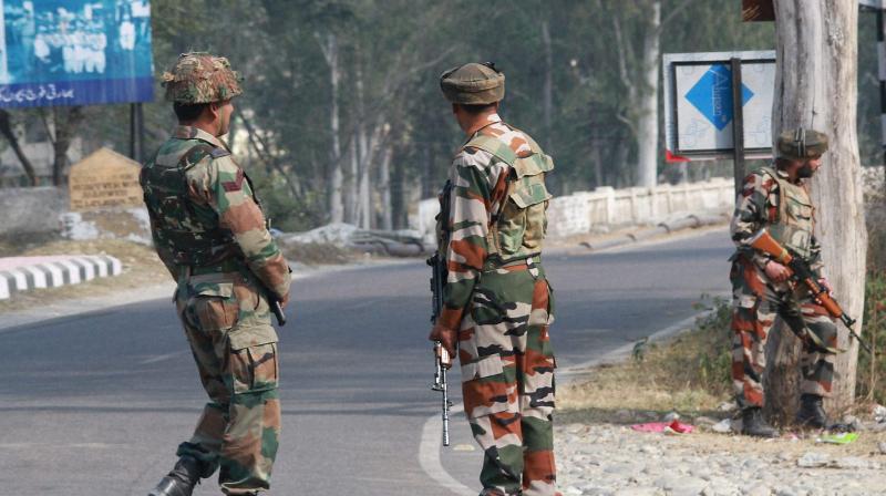 Security personnel take positions during a gun battle with suspected militants at Army camp at Nagrota near Jammu. (Photo: PTI)