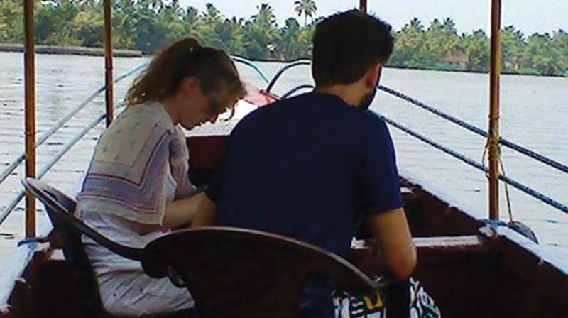 A foreign couple enjoy the shikhara ride without wearing life jacket. A recent picture from Punnamda. (Photo: DC)