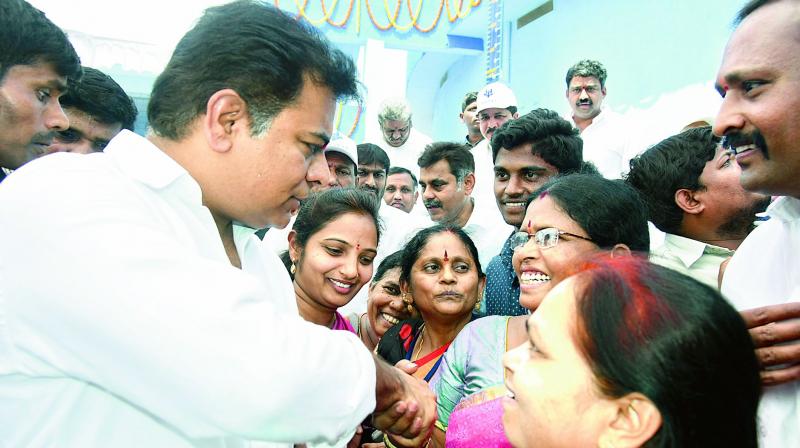 Minister K. T. Rama Rao interacts with women during the inaguration of the reservoir at KPHB IV Phase as part of Mission Bhagiratha project at Kukatpally Circle in Hyderabad on Thursday. The minister has also inaugurated three other reservoirs at Gopanpally, Nallagandla and Miyapur.  (Photo: DC)