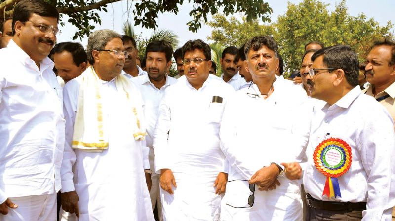 CM Siddaramaiah, MLA P.M. Narendra Swamy and ministers D.K. Shivakumar and M.P. Patil during inauguration of developmental projects at Malavalli in Mandya district on Thursday. (Photo: KPN)