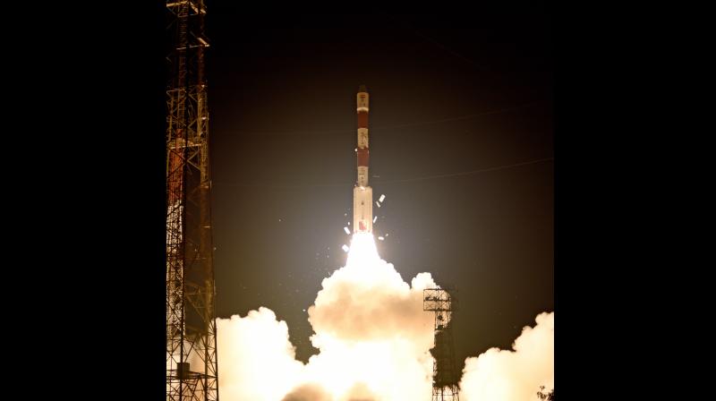 PSLV-C41 lifted off majestically leaving orange flames behind illuminating the Shar during the predawn launch at 4.04 am IST, as planned, from the First Launch Pad. (Photo: DC)