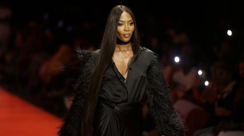 British model Naomi Campbell displays an outfit by designer Tiffani Amber during the ARISE Fashion Week event in Lagos, Nigeria, Sunday, April 1, 2018. (Photo: AP)