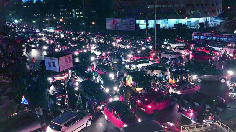 Due to the heavy downpour in the Cyberabad city limits heavy traffic jams were witnessed in the IT hub. Traffic stuck at Hitec City junction on Monday night. (Photo: DC)