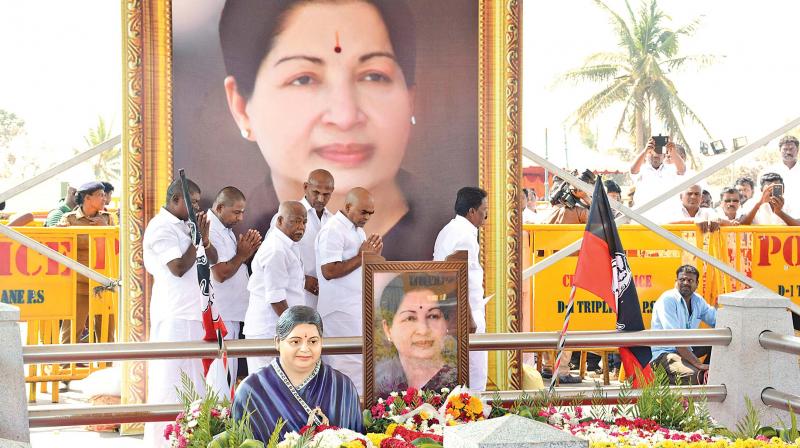 A bust-sized statue of former Chief Minister J. Jayalalithaa placed before her portrait at the memorial on Marina where she was laid to rest. (Photo: DC)