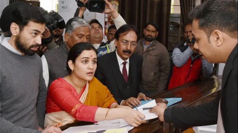 Aparna Yadav (SP), daughter-in-law of Mulayam Singh Yadav, filling her nomination papers for UP Assembly Election in Lucknow. (Photo: AP)