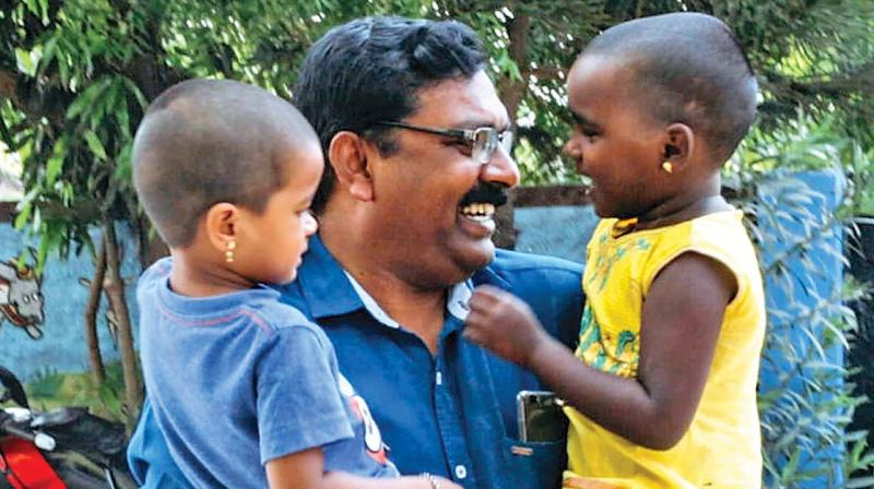 Solomon Raj with his kids from Shelter Trust.