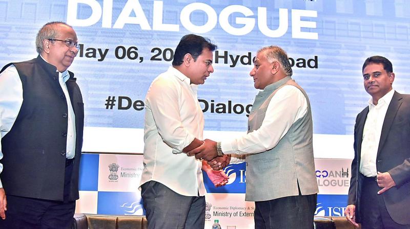 Union minister of state for external affairs V.K. Singh (right) speaks to IT minister K.T. Rama Rao during the inaugural session of Deccan Dialogue at ISB on Sunday. (Photo: DC)
