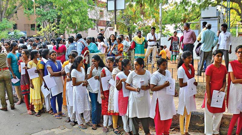 Students waiting to write the Neet exam in Chennai on Sunday. (Photo: DC)
