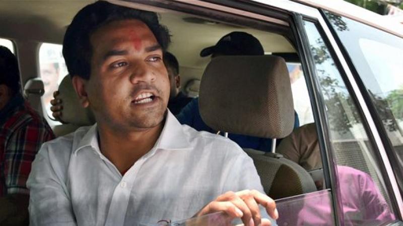 Sacked Delhi minister Kapil Mishra speaks to media near his residence as his hunger strike continued on the fourth consecutive day in New Delhi on Saturday. (Photo: PTI)
