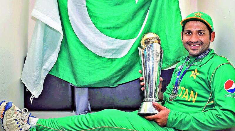 Pakistan captain Sarfraz Ahmed poses with the trophy.