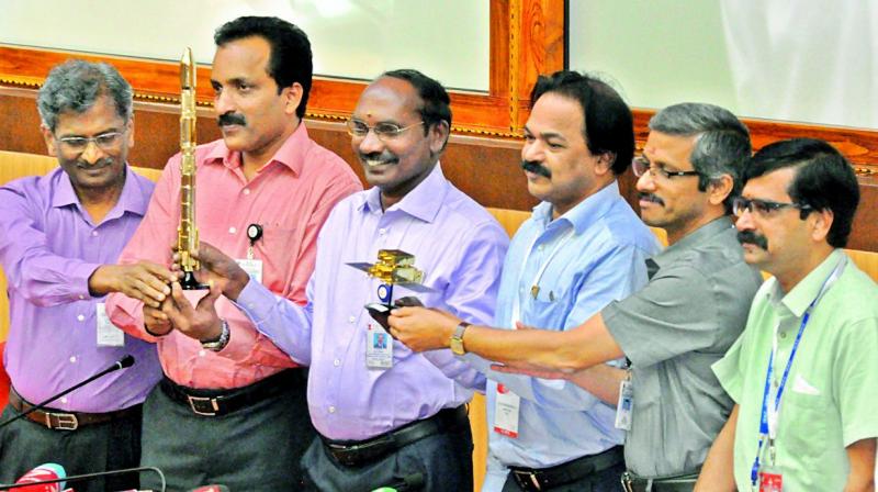 Isro chairman K. Shivan (centre) poses for a photograph along his colleagues during a press meet at Sriharikota in Nellore district on Thursday. 	Image: DC