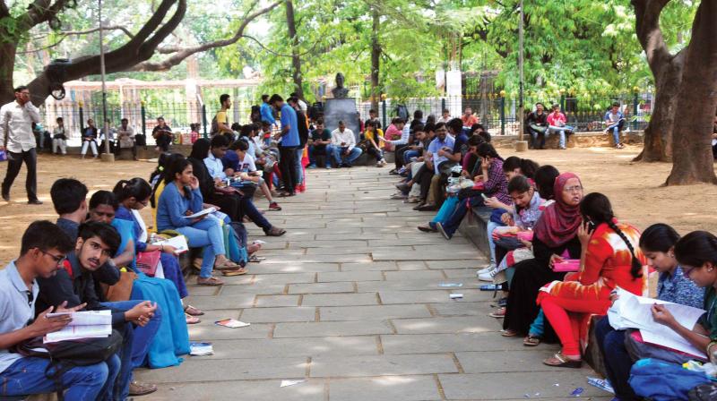 Students preparing for CET exam near Sheshadripuram College in Bengaluru on Thursday   (Image: KPN)