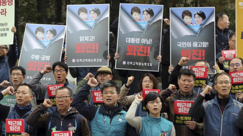 South Korean union members shout slogans during a rally calling for South Korean President Park Geun-hye to step down in downtown Seoul. (Photo: AP)