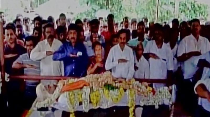 Family and party workers pay respect to the murdered RSS worker Sharath. (Photo: Twitter | ANI)