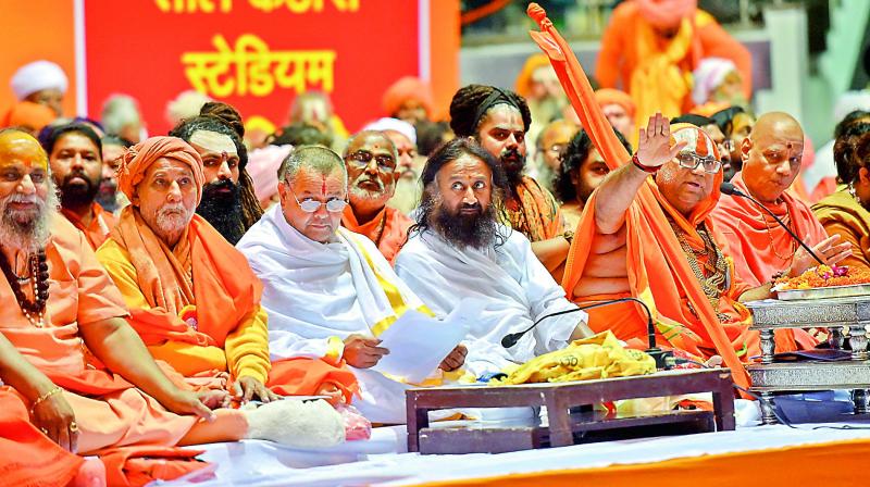 Spiritual guru Sri Sri Ravi Shankar, Akhil Bhartiya Sant Samiti chief Jagadguru Hansdevacharya and others attend the Dharmadesh, a two-day meeting of Hindu seers, in New Delhi, on Sunday. (Photo: AP)