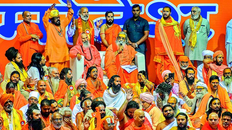 Seers at the Dharmadesh, a two-day meeting of Hindu seers organised for national integration, at Talkatora Stadium, in New Delhi, Sunday. (Photo: AP)