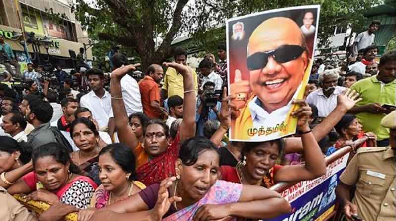 DMK supporters react after the party president M Karunanidhi passed away, in Chennai. (Photo: PTI)