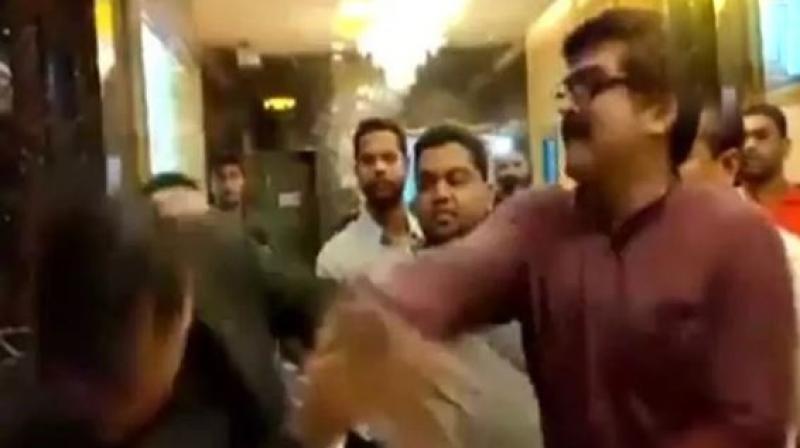 In a video that is being widely circulated on the internet, MNS workers can be seen slapping and abusing the manager. (Photo: Screengrab | ANI)