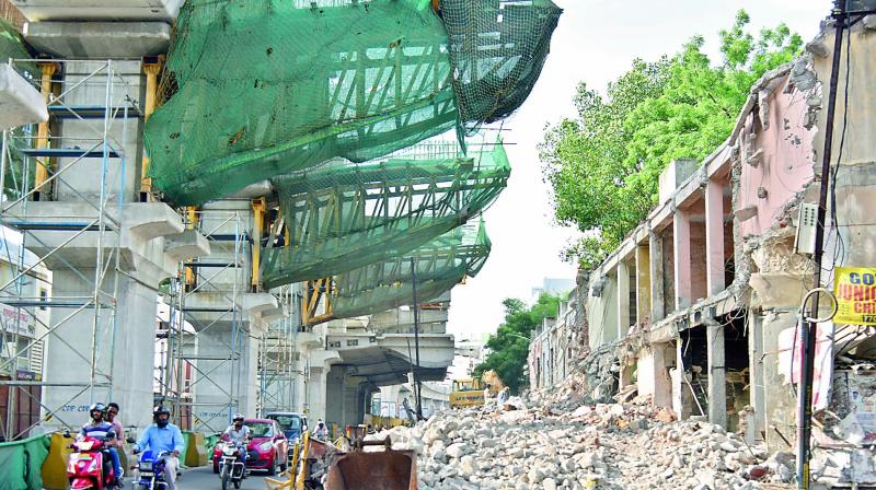 A building has been demolished as part of road widening work under the HMR station at Chikkadpally on Wednesday. 	(Image: DC)