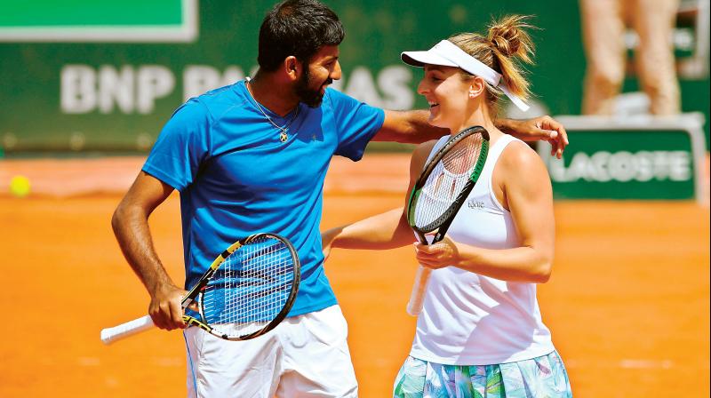 Rohan Bopanna and Gabriela Dabrowski celebrate after winning their mixed doubles final in Paris on Thursday. (Photo: AFP)