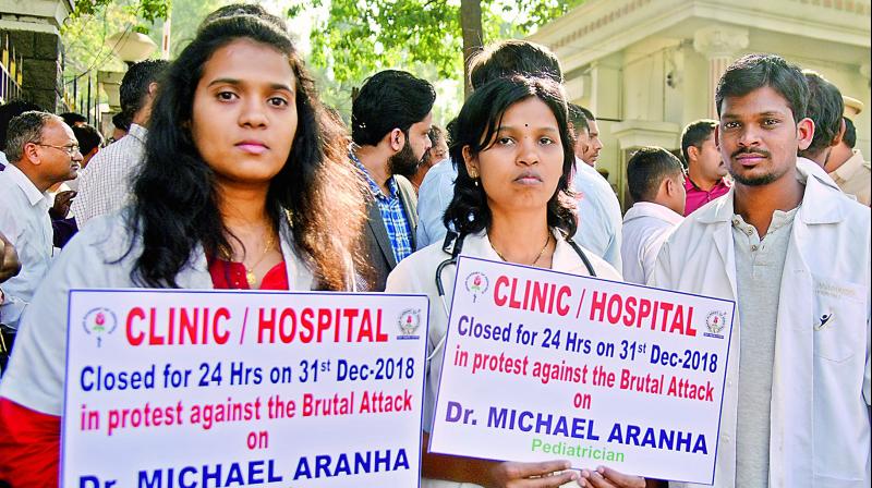 Doctors protest at the DGP office against the attack on pediatrician, Dr Michael Aranha, in Hyderabad on Monday.	  DC