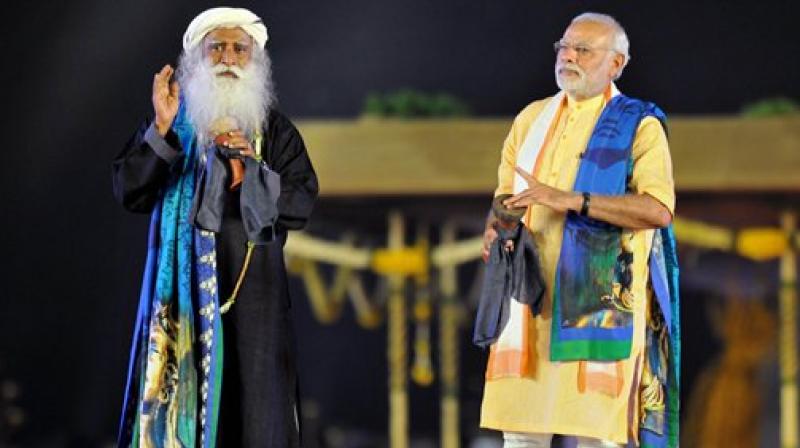 Prime Minister Narendra Modi with Sadhguru Jaggi Vasudev during the unveiling function of 112-feet iconic statue of Adiyogi Lord Shiva at Isha Foundation in Coimbatore. (Photo: PTI)