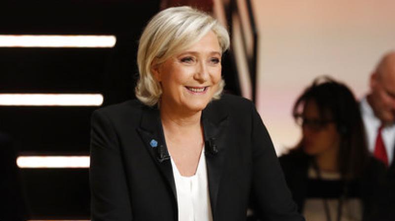 Marine Le Pen smiles prior to a television debate at French TV station TF1 in Aubervilliers, outside Paris, France, Monday, March 20, 2017. (Photo: AP)