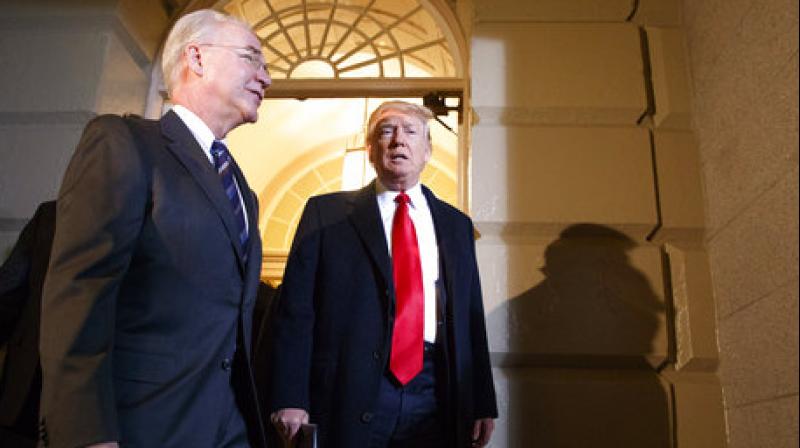 President Donald Trump and Heath and Human Services Secretary Tom Price arrive on Capitol Hill in Washington, Tuesday, March 21, 2017, for a meeting on healthcare with Republicans. (Photo: AP)