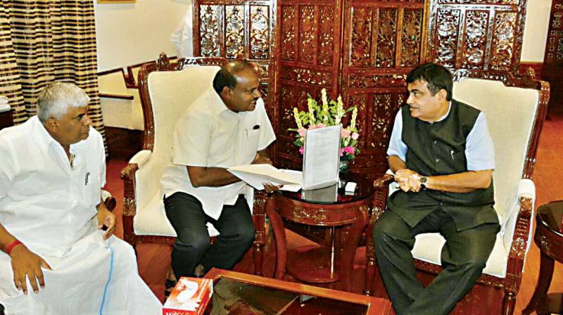 Public Works Minister H.D. Revanna and CM Kumaraswamy hold talks with Union Road Transport Minister Nitin Gadkari in Delhi on Monday 	 DC