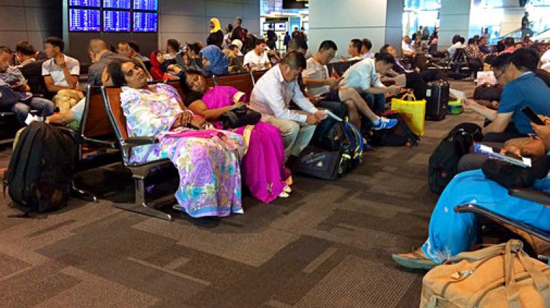 Passengers of cancelled flights wait in Hamad International Airport (HIA) in Doha, Qatar. Qatars foreign minister says Kuwait is trying to mediate a diplomatic crisis in which Arab countries have cut diplomatic ties and moved to isolate his energy-rich, travel-hub nation from the outside world.