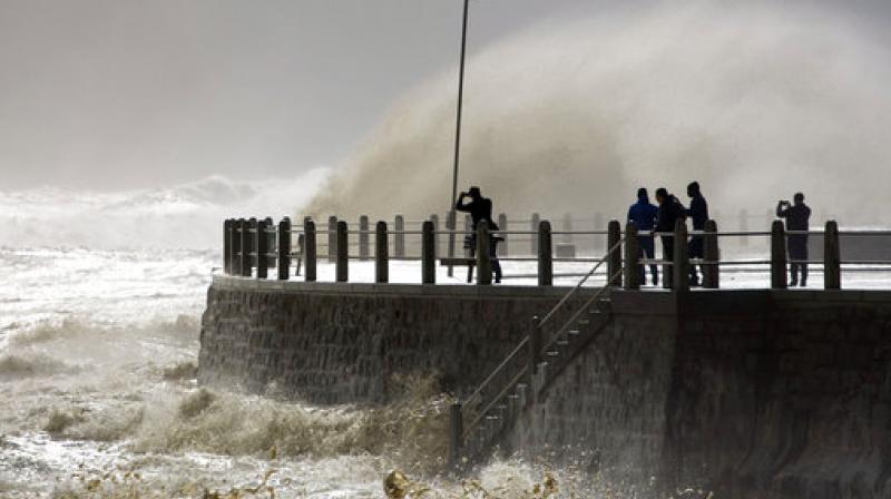 Huge waves slam into the promenade during heavy storms in the Sea Point neighborhood of Cape Town, South Africa. (Photo: AP)
