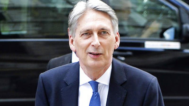 Britains Chancellor Philip Hammond arrives at the Treasury in Whitehall, London, after Downing Street said that Theresa May is to leave her most senior Cabinet team in place following a disastrous election which left the party short of a majority in parliament. (Photo: AP)