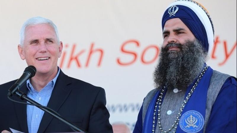 US Vice-President Mike Pence with Indian-American Sikh leader Gurinder Singh Khalsa. (Photo: PTI/File)