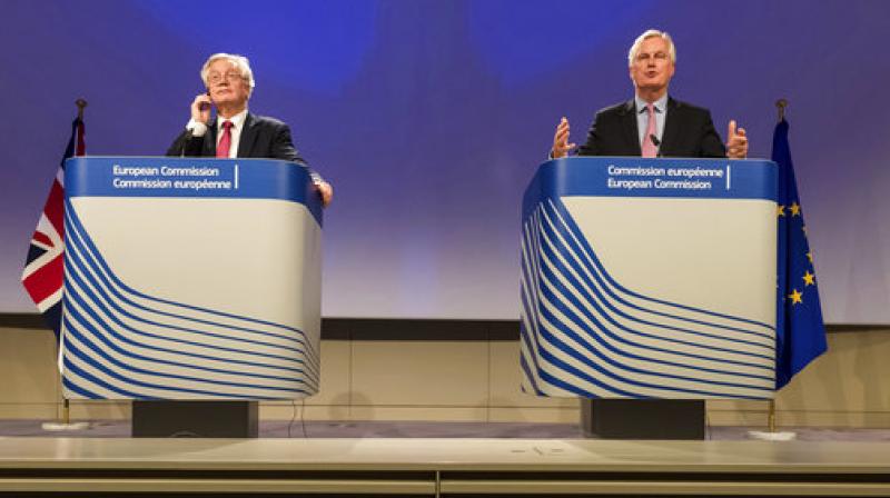 EU Chief Brexit Negotiator Michel Barnier, right, and British Secretary of State for Exiting the EU David Davis attend a media conference at EU headquarters in Brussels on Monday. (Photo: AP)