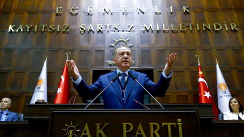 Turkeys President Recep Tayyip Erdogan, gestures as he talks to members of the ruling Justice and Development party (AKP), in Ankara, Turkey. (Photo: AP)