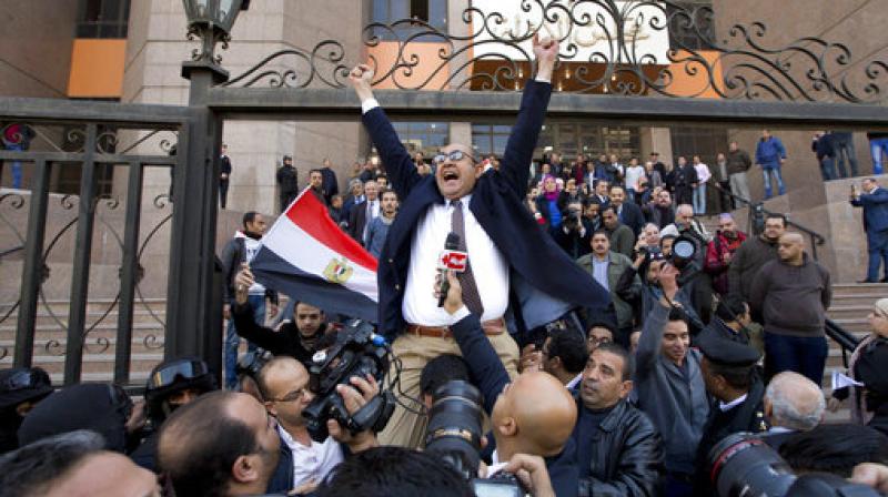 lawyer and former presidential candidate Khaled Ali, center, celebrates with others after the Supreme Administrative Court said two islands, Sanafir and Tiran, are Egyptian, debunking the governments claim that they were Saudi, in Cairo, Egypt. (Photo: AP)