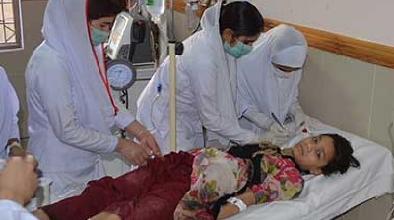 Pakistani nursing staff attend an injured girl at a hospital in Quetta, Pakistan. A powerful bomb went off near the office of the provincial police chief in southwest Pakistan on Friday, causing casualties, police said.