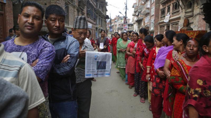 Millions of people in Nepal are voting Wednesday, June 28, in the second phase of local elections to choose municipal and village councils despite threats from ethnic groups that oppose the polls. (Photo: AP)