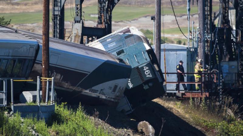 Emergency crews respond to the scene of a train derailment near Chambers Bay on Sunday, July 2, 2017, in Tacoma, Wash. There appear to be only minor injuries from the waterfront derailment of the Amtrak Cascades train near the town of Steilacoom, the Pierce County Sheriffs Office said on Twitter. The train runs between Vancouver, Canada, and Eugene-Springfield, Oregon. (Photo: AP)