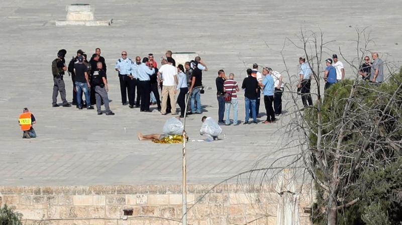 Israeli police check the scene where assailants fired shots in Jerusalems Old City. (Photo: AFP)