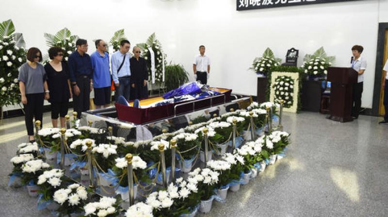 China says the body of Liu Xiaobo, who died this week after a battle with liver cancer, has been cremated. The government of the city of Shenyang in northeastern China, where Liu was treated, said in a briefing that the cremation took place Saturday morning in a ceremony attended by family and friends. (Photo: AP)